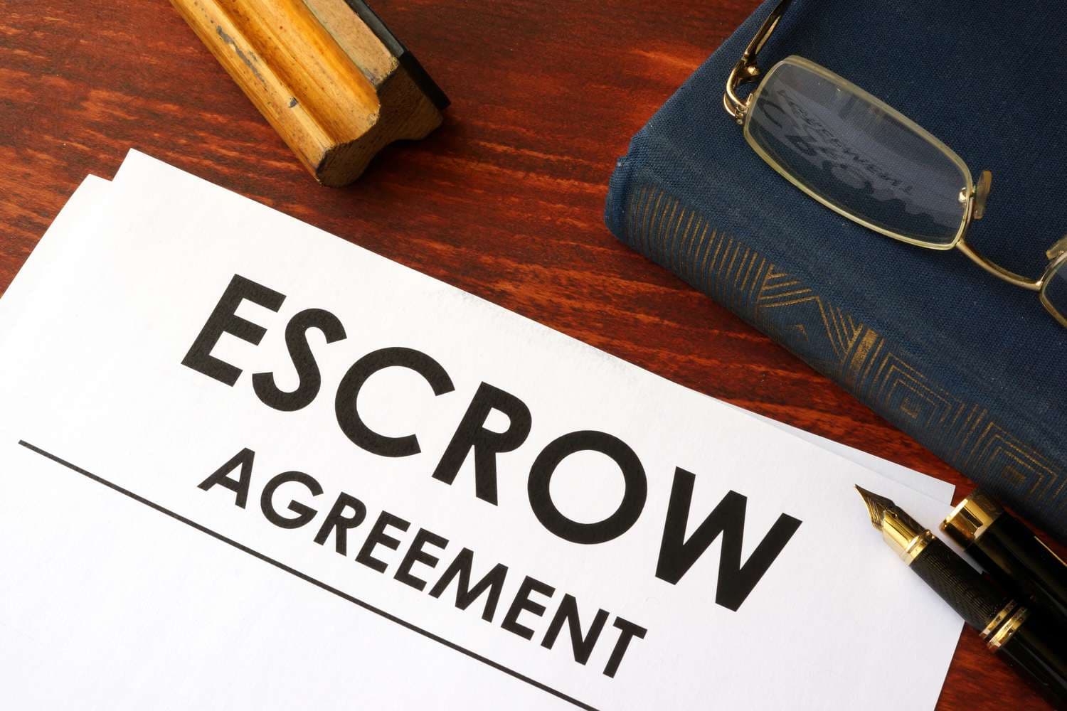 What Does Escrow (in Escrow) Mean, and How Does It Work?